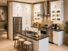 White shaker kitchen with island and glass doors